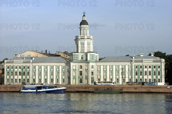 RUSSIA, St Petersburg, View over the River Neva toward boat moored by riverside architecture