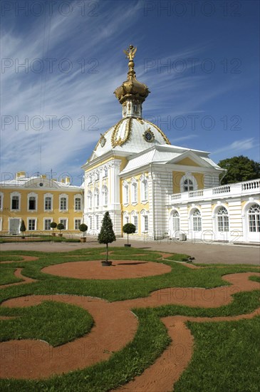 RUSSIA, St Petersburg, Peterhof Palace also known as Petrodvorets. Monplaisir palace with patterned lawn in the foreground