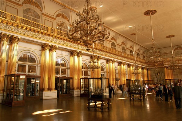 RUSSIA, St Petersburg, The Hermitage exhibition hall with encased exhibits and hanging chandeliers