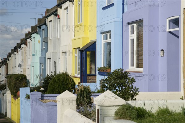 ENGLAND, East Sussex, Brighton, Colourfully painted terraced housing in Bear Road.