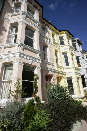 ENGLAND, East Sussex, Brighton, Brightly coloured terraced Kemp Town houses in Chesham Street