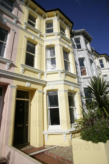 ENGLAND, East Sussex, Brighton, Brightly coloured terraced Kemp Town houses in Chesham Street