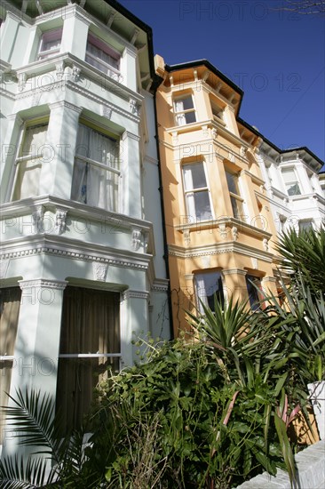 ENGLAND, East Sussex, Brighton, Brightly coloured terraced Kemp Town houses in Chesham Street