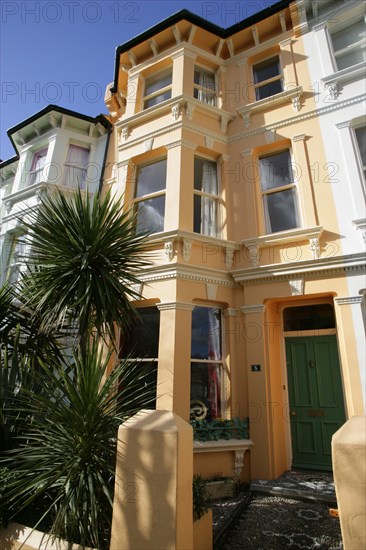 ENGLAND, East Sussex, Brighton, Brightly coloured terraced Kemp Town houses in Chesham Street