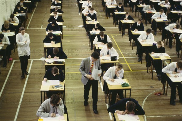 EDUCATION, Secondary, Exam, Pupils sitting O level exam watched by invigilators. GCSE