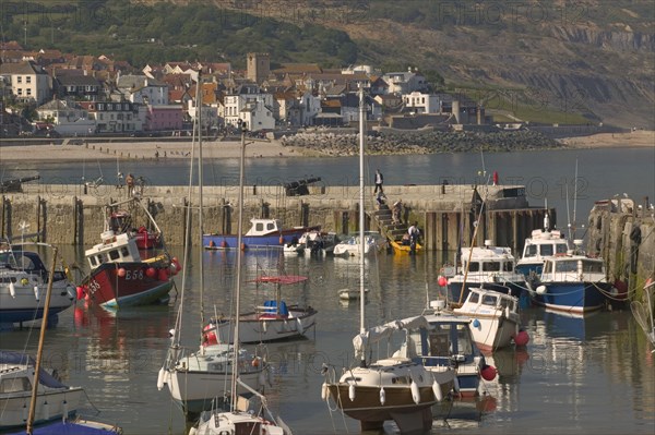 ENGLAND, Dorset, Lyme Regis, View of the town across the harbour from The Cobb.