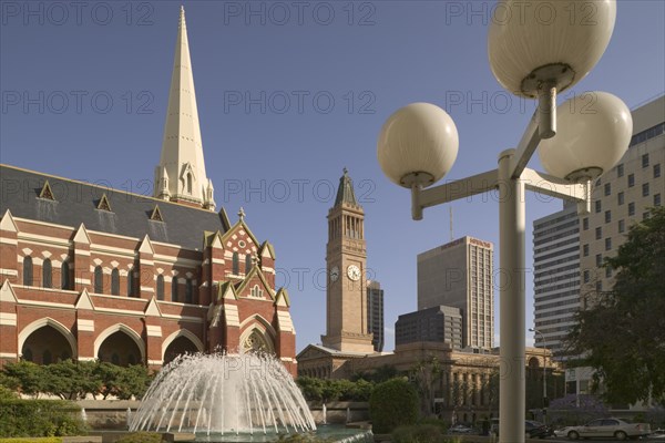 AUSTRALIA, Queensland, Brisbane, View of Brisbane City Hall in King George Square with the Albert Street Unit Church in the foreground.