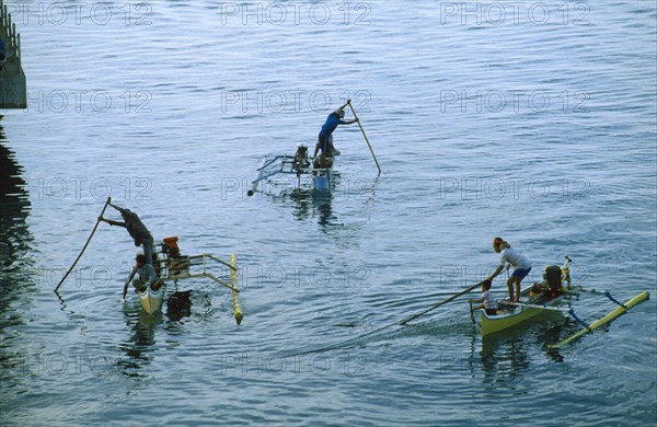 INDONESIA, Industry, Fishing, Fishermen in small outriggers.