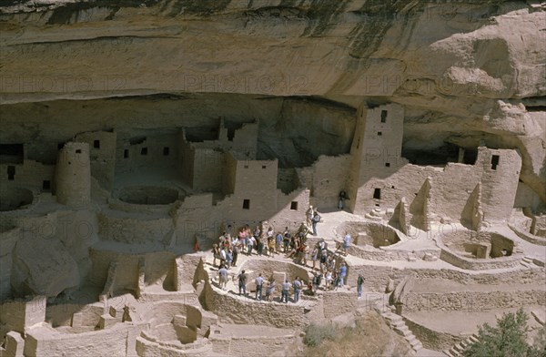 USA, Colorado, Mesa Verde Nat Park, View of the Cliff Palace which is the largest Anasazi cliff dwelling with tourist group