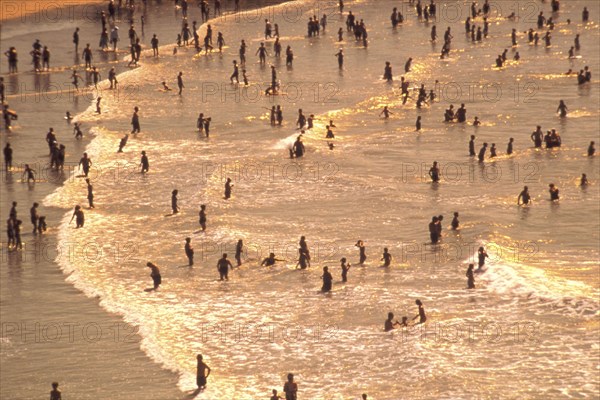 ARGENTINA, Buenos Aires, Mar del Plata, Beach scene with bathers in the shallow water of the sea