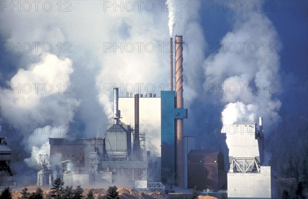 CANADA, British Columbia, Skookumchuck, Papermill emitting smoke and steam