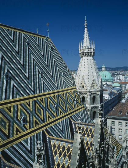 AUSTRIA, Vienna, St Stephens Cathedral aka Stephensdom with patterned roof tiles and spire seen from the North tower