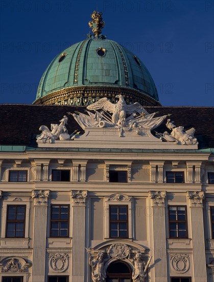 AUSTRIA, Vienna, Hofburg Royal Palace. St Michael Gate facade detail and green dome seen from In der Burg Courtyard