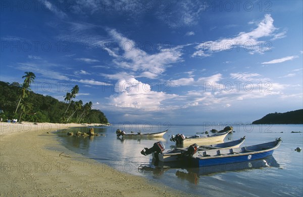 MALAYSIA, Terengganu, Perhentian Besar, Boats moored along quiet sandy beach on larger of the two Perhentian Islands.