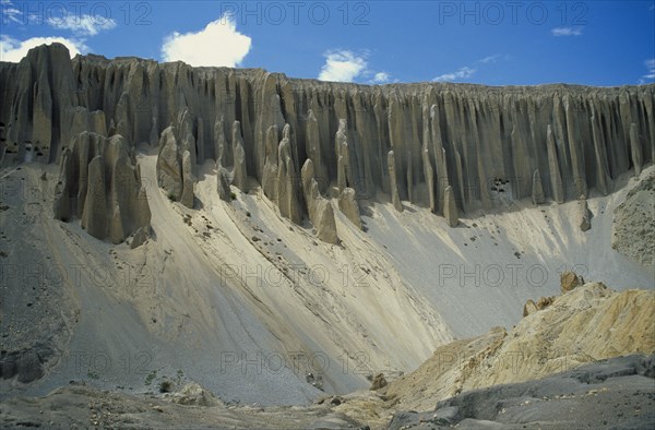 NEPAL, Mustang, Organ Pipe Cliffs , Eroded cliffs and ancient cave dwellings near Yara.