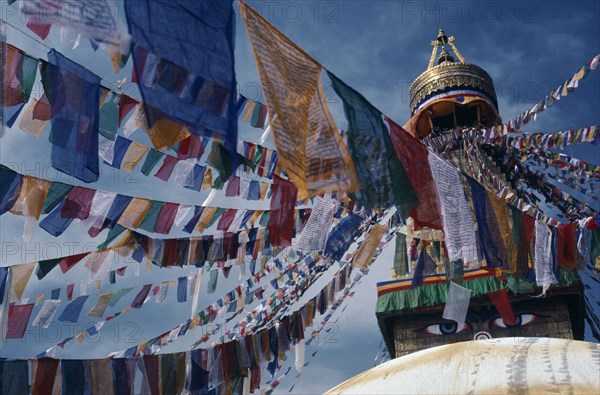 NEPAL, Kathmandu Valley, Bodhanath, Stupa hung with prayer flags for Tibetan New Year celebrations.