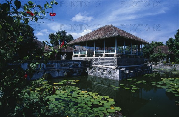 INDONESIA, Bali, Amlapura, Ornamental lake with water lillies at the old palace of the Raja of Karangasem.