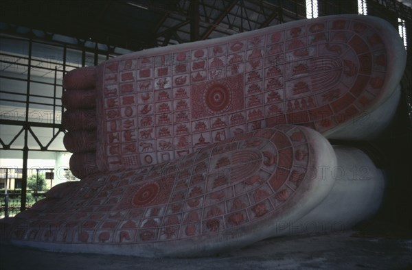 MYANMAR, Shwethalyaung, Giant reclining Buddha figure representing his death or parinirvana.  Detail of soles of feet.