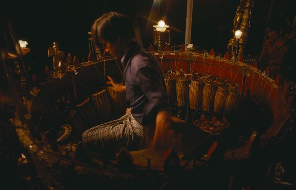 MYANMAR, Music, Musician playing circle of drums. Pat Waing