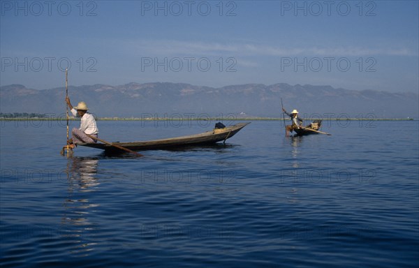 MYANMAR, Inle Lake, Fishermen with narrow wooden canoes.