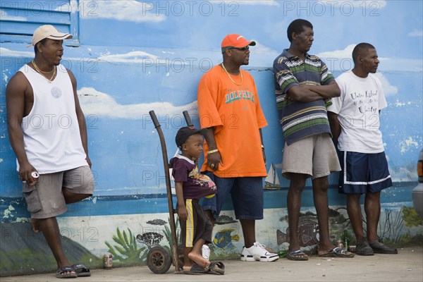 WEST INDIES, St Vincent & The Grenadines, Union Island, Group of spectators at the Easterval Easter Carnival in Clifton