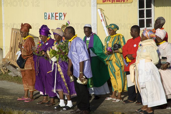 WEST INDIES, St Vincent & The Grenadines, Union Island, Baptist preacher and congregation in Clifton at Easter morning harbourside service for those lost at sea