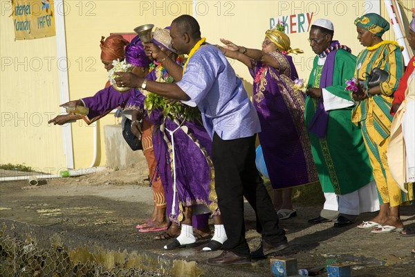 WEST INDIES, St Vincent & The Grenadines, Union Island, Baptist preacher and congregation in Clifton at Easter morning harbourside service for those lost at sea