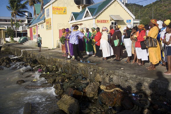 WEST INDIES, St Vincent & The Grenadines, Union Island, Baptist preacher and congregation in Clifton at Easter morning harbourside service for those lost at sea