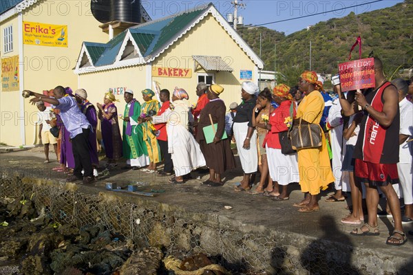 WEST INDIES, St Vincent & The Grenadines, Union Island, Baptist preacher and congregation in Clifton at Easter morning harbourside service for those lost at sea