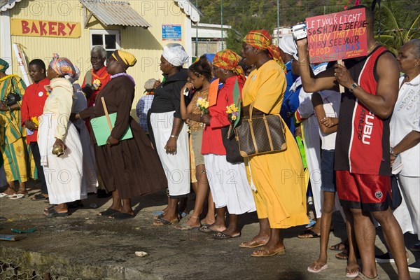 WEST INDIES, St Vincent & The Grenadines, Union Island, Baptist congregation in Clifton at Easter morning harbourside service for those lost at sea