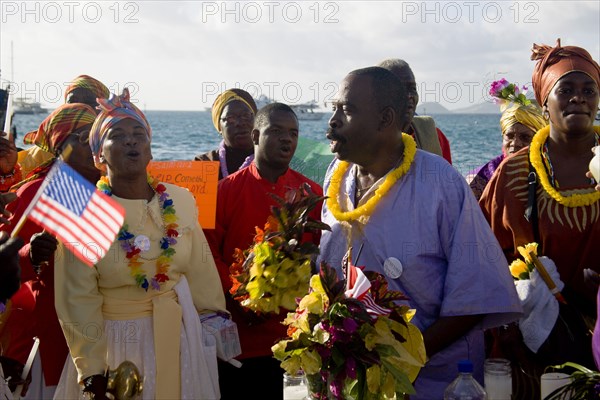 WEST INDIES, St Vincent & The Grenadines, Union Island, Preacher and Baptist congregation in Clifton at Easter morning harbourside service for those lost at sea