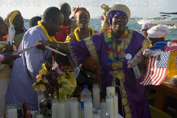 WEST INDIES, St Vincent & The Grenadines, Union Island, Baptist preacher and congregation in Clifton at Easter morning harbourside service for those lost at sea