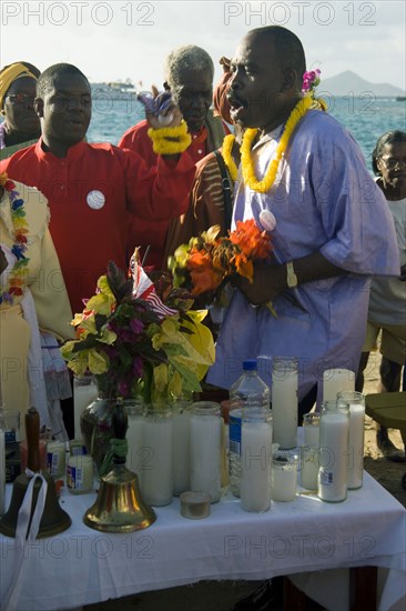 WEST INDIES, St Vincent & The Grenadines, Union Island, Baptist preacher and congregation in Clifton at Easter morning harbourside service for those lost at sea