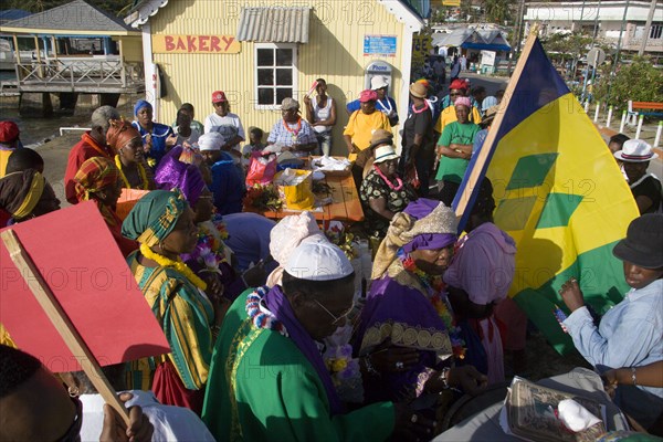 WEST INDIES, St Vincent & The Grenadines, Union Island, The Baptist congregation in Clifton at Easter morning harbourside service for those lost at sea