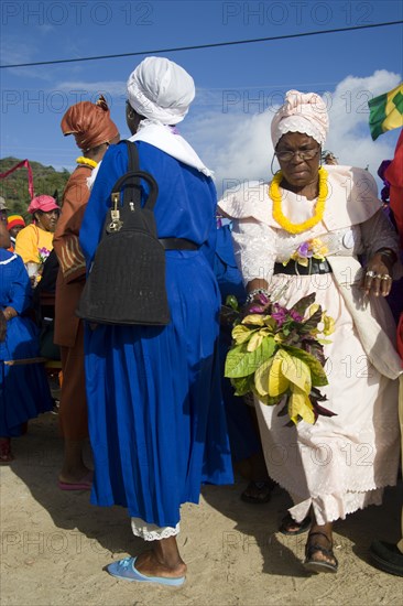 WEST INDIES, St Vincent & The Grenadines, Union Island, Women of the Baptist congregation in Clifton at Easter morning harbourside service for those lost at sea