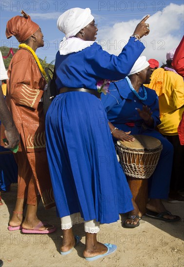 WEST INDIES, St Vincent & The Grenadines, Union Island, Women of the Baptist congregation in Clifton at Easter morning harbourside service for those lost at sea