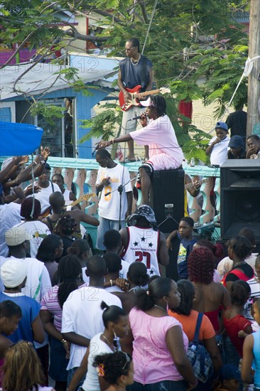 WEST INDIES, St Vincent & The Grenadines, Union Island, Singer and guitarist with sound system at Easterval Easter Carnival in Clifton