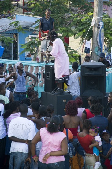 WEST INDIES, St Vincent & The Grenadines, Union Island, Singer and guitarist with sound system at Easterval Easter Carnival in Clifton