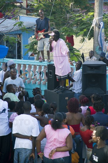 WEST INDIES, St Vincent & The Grenadines, Union Island, Singer and guitarist with sound system at Easterval Easter Carnival in Clifton