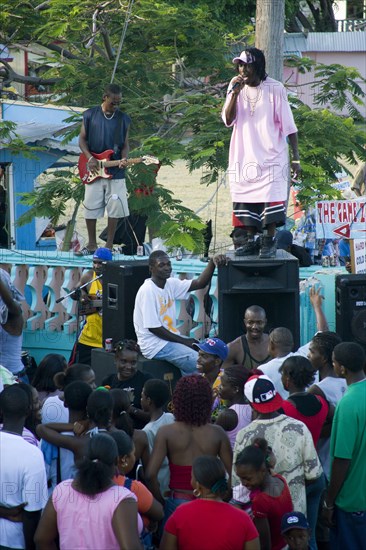 WEST INDIES, St Vincent & The Grenadines, Union Island, Singer and guitarist with sound system at Easterval Easter Carnival in Clifton