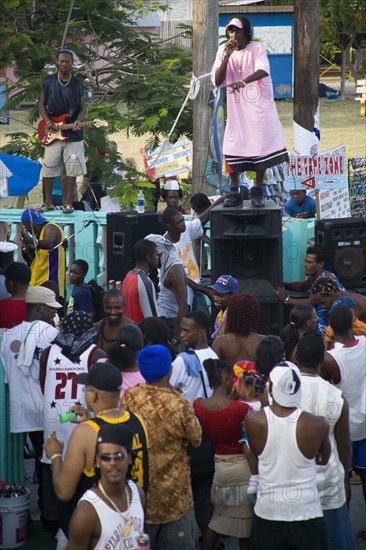 WEST INDIES, St Vincent & The Grenadines, Union Island, Singer and guitarist with sound system at Easterval Easter Carnival in Clifton