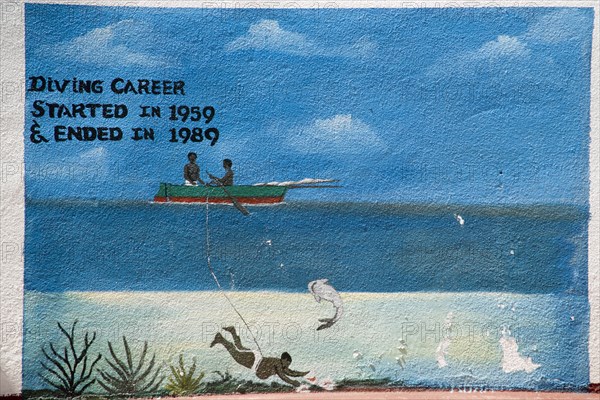WEST INDIES, St Vincent & The Grenadines, Union Island, Wall painting in Clifton depicting the short lifespan of a conch shell diver