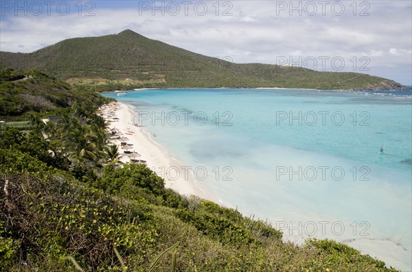 WEST INDIES, St Vincent & The Grenadines, Canouan, Godahl beach at Raffles Resort with Mount Royal on the horizon