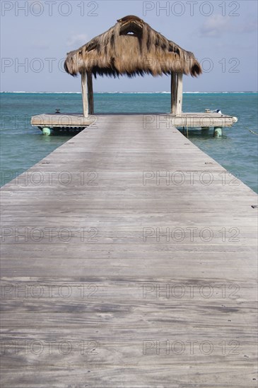 WEST INDIES, St Vincent & The Grenadines, Canouan, The jetty on Jambu Beach at Raffles Resort