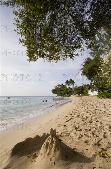 WEST INDIES, Barbados, St Peter, Gibbes Bay beach in the late afternoon with sandcastles at the waters edge