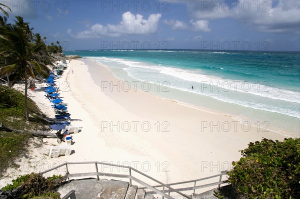 WEST INDIES, Barbados, St Philip, Crane Beach with sunbeds and umbrellas on the beach edge