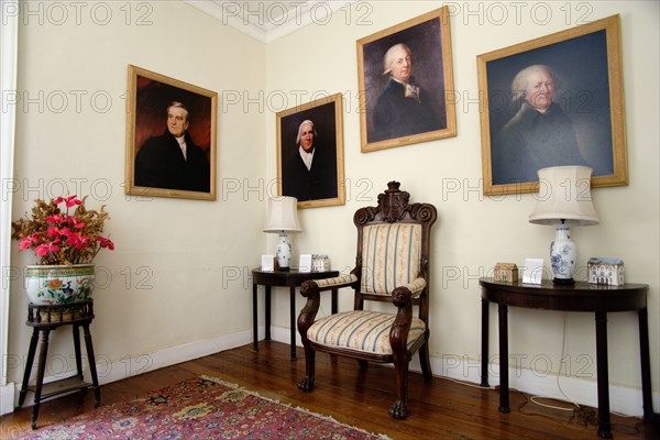 WEST INDIES, Barbados, St Peter, Interior of the Jacobean plantation house of St Nicholas Abbey showing oil paintings of past owners