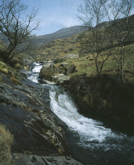 WALES, Snowdonia, Cwm y Llan Waterfall, Waterfall cascading over rocks in stream flowing south east from Snowdon to Nant Gwynant