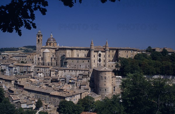 ITALY, Marche, Urbino, "Palazzo Ducale, Renaissance palace above the town. View through trees."