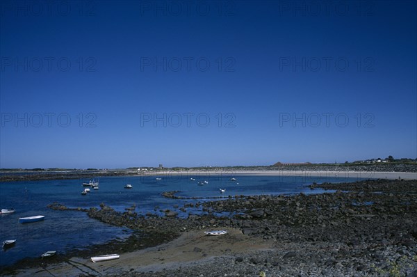 UNITED KINGDOM, Channel Islands, Guernsey, St Saviours. Perelle Bay rocky shoreline.